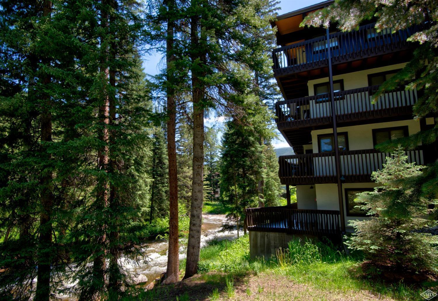 4570 Vail Racquet Club Drive, Unit 21 Vail, CO 81657 - Photo 1 of 16 front view of a house with a tree