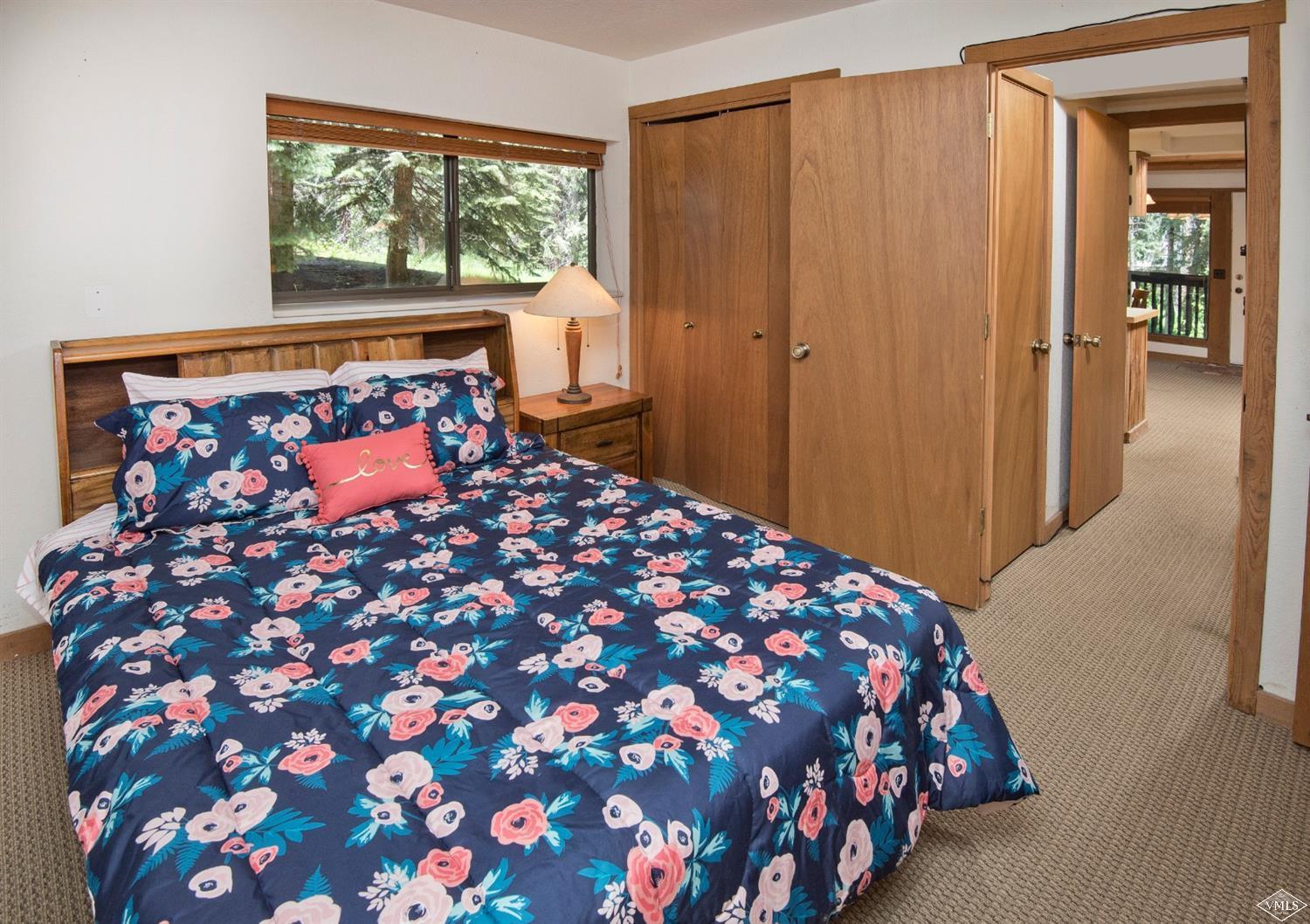 4570 Vail Racquet Club Drive, Unit 21 Vail, CO 81657 - Photo 11 of 16 a bedroom with a bed and window