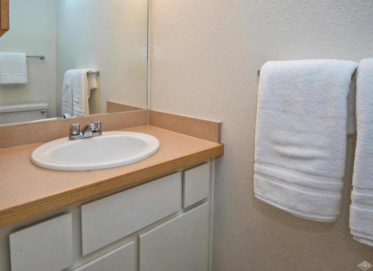 4570 Vail Racquet Club Drive, Unit 21 Vail, CO 81657 - Photo 13 of 16 a bathroom with a sink and a mirror