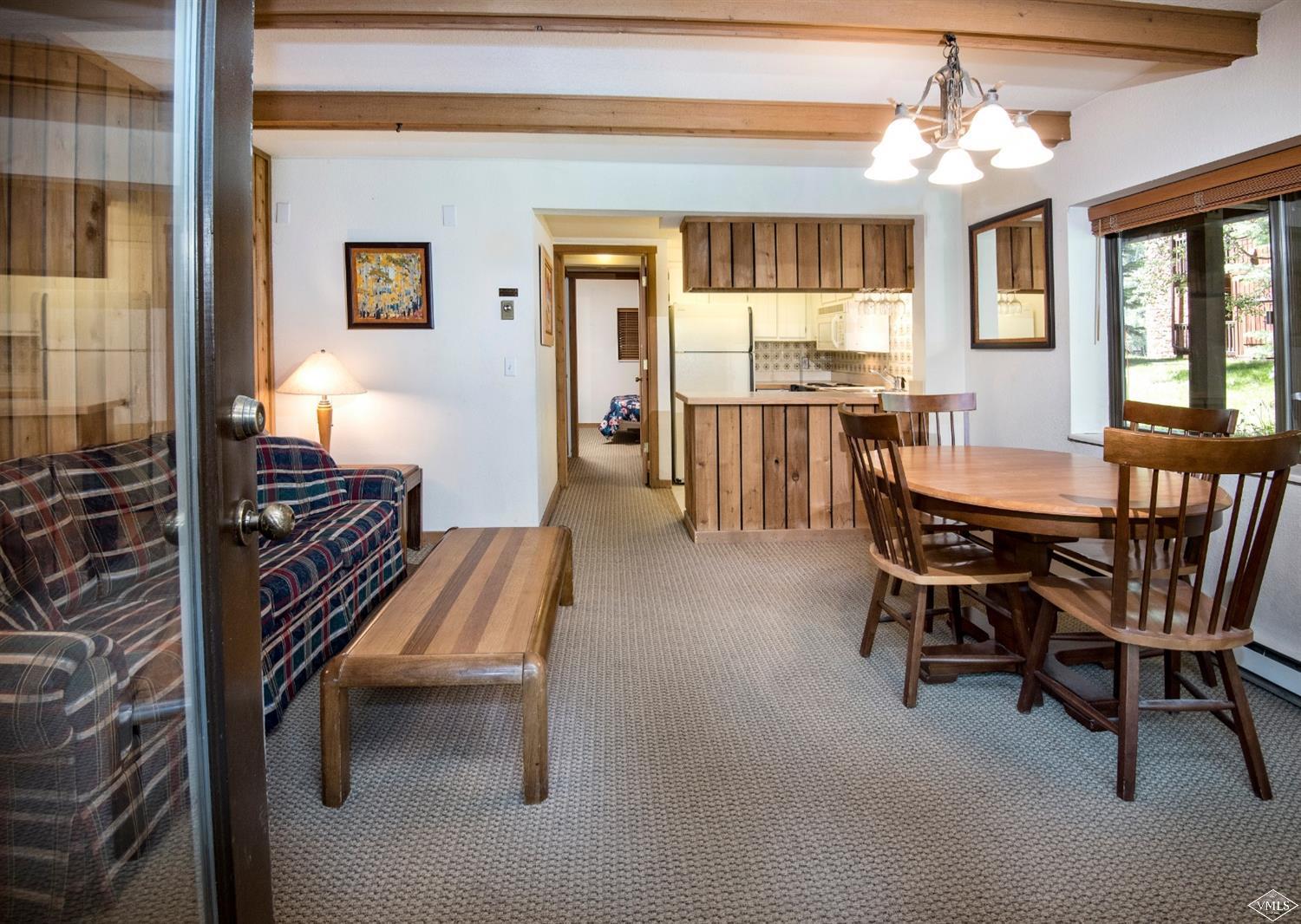 4570 Vail Racquet Club Drive, Unit 21 Vail, CO 81657 - Photo 5 of 16 a dining room with furniture and window