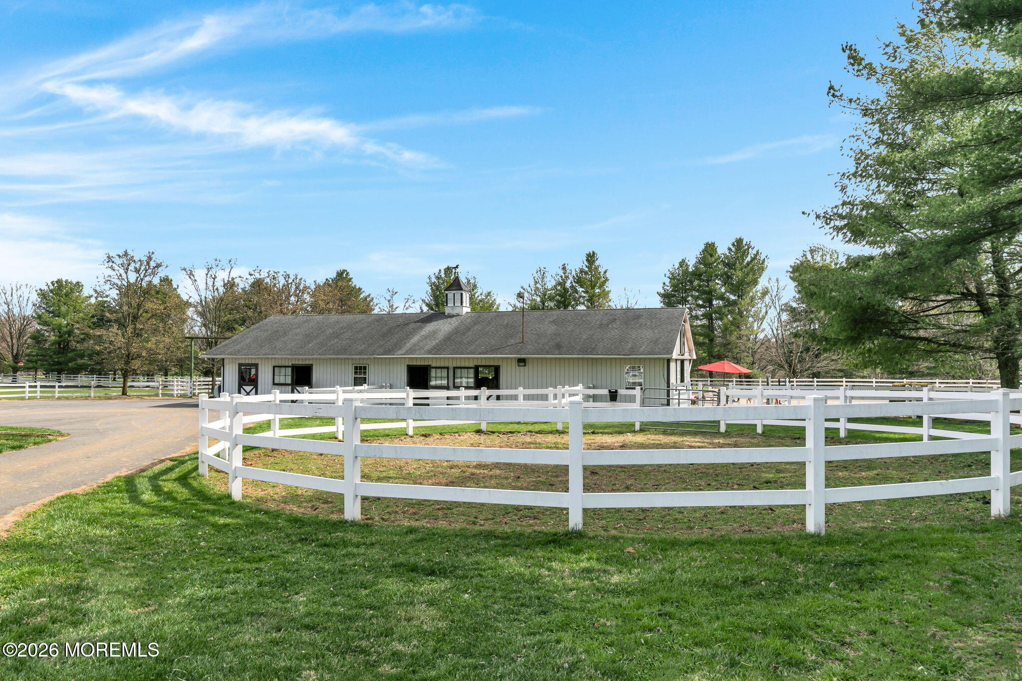10 Paddock Lane Colts Neck, NJ 07722 - Photo 17 of 55 a view of a house with a yard porch and sitting area