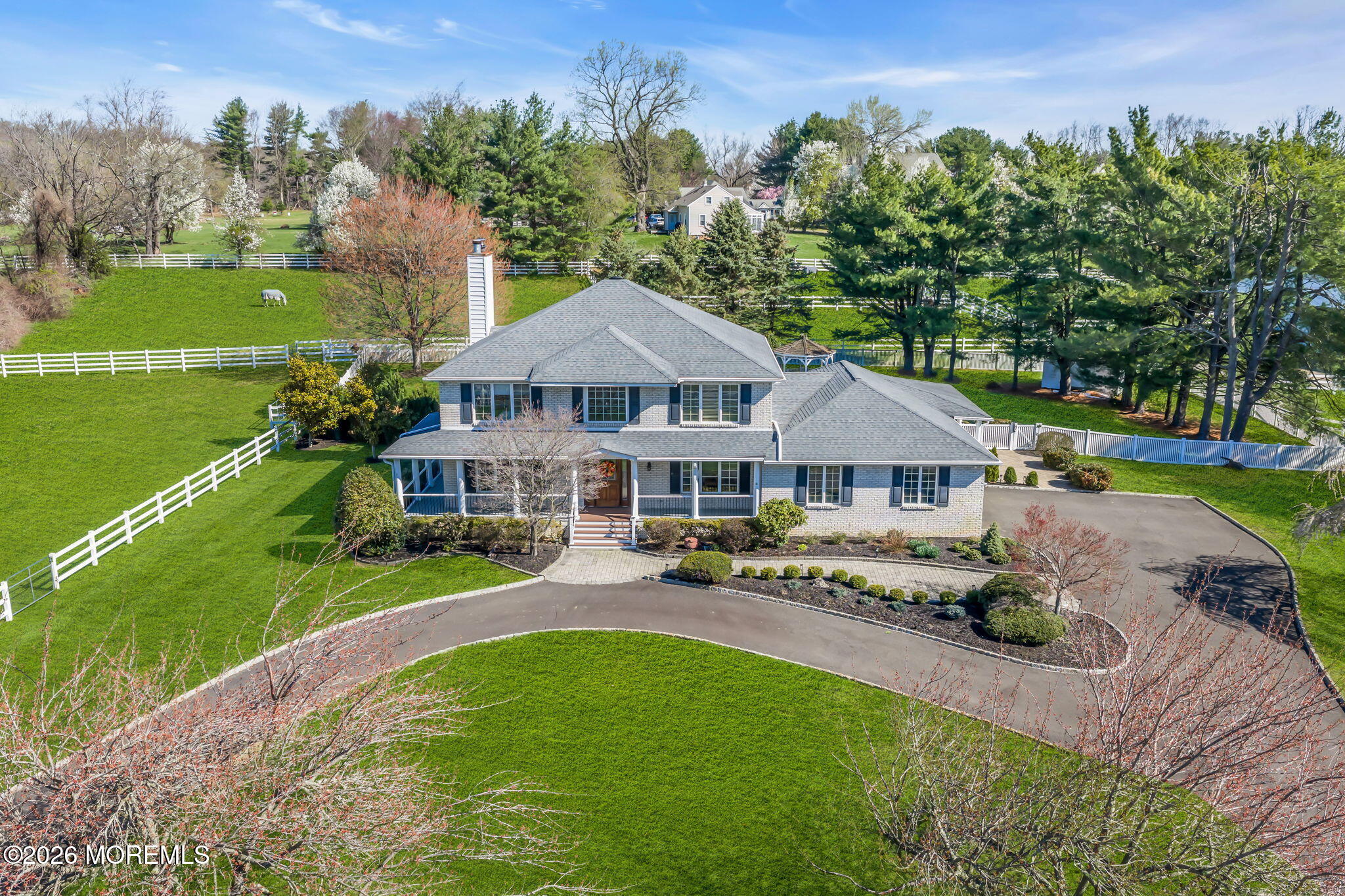 10 Paddock Lane Colts Neck, NJ 07722 - Photo 2 of 55 an aerial view of a house with garden space and a patio