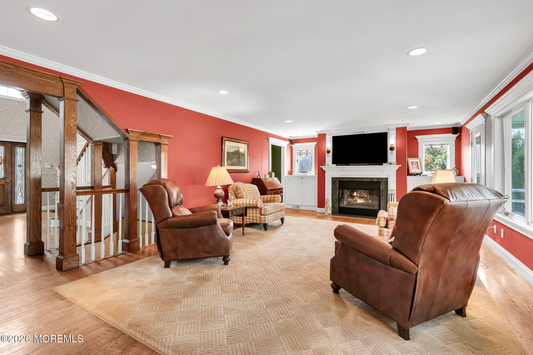 10 Paddock Lane Colts Neck, NJ 07722 - Photo 29 of 55 a living room with furniture fireplace and a flat screen tv