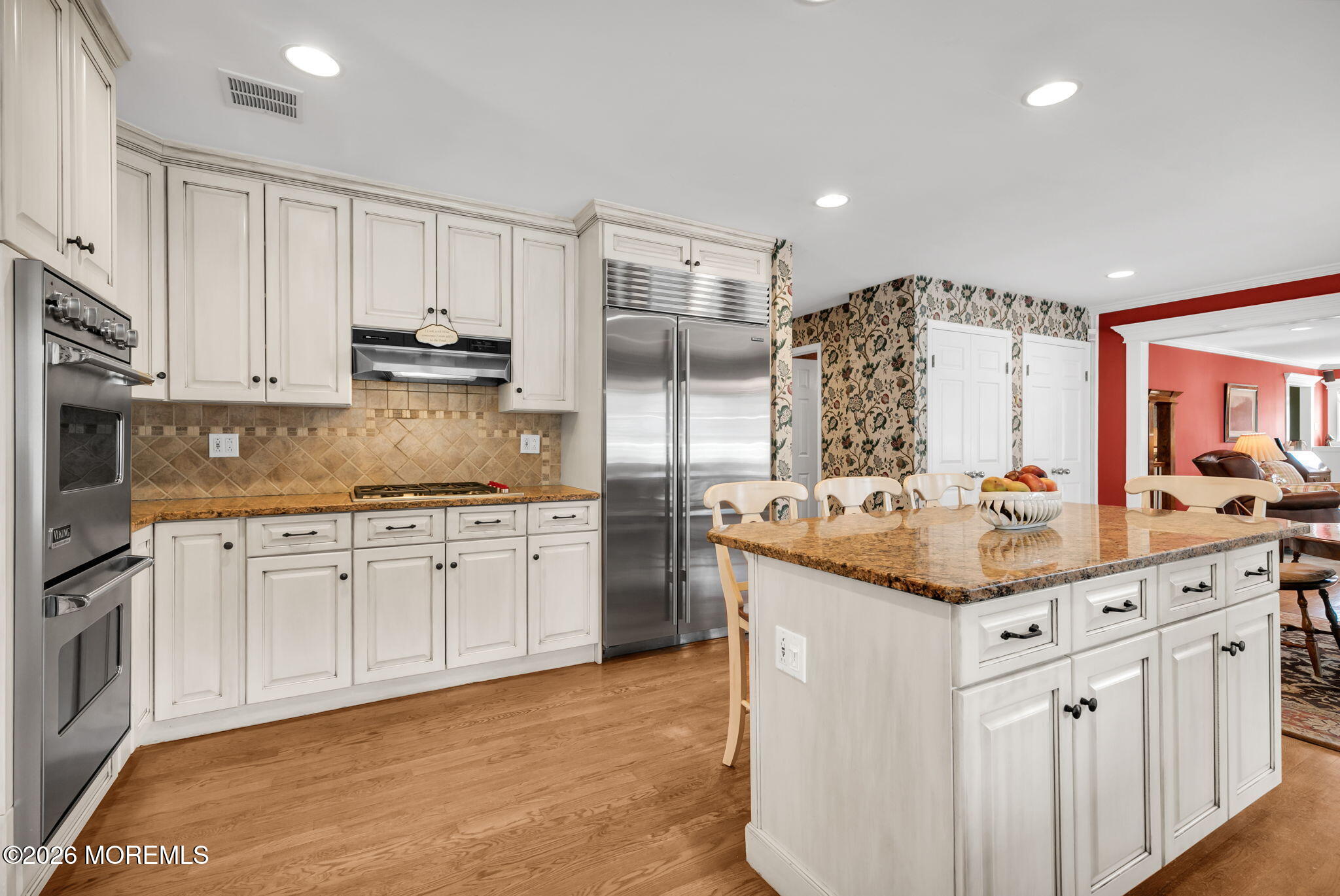 10 Paddock Lane Colts Neck, NJ 07722 - Photo 32 of 55 a kitchen with stainless steel appliances granite countertop a sink and cabinets