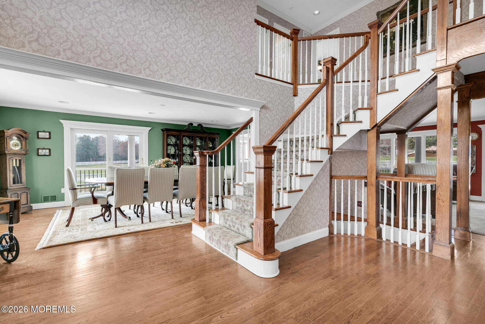 10 Paddock Lane Colts Neck, NJ 07722 - Photo 40 of 55 a view of entryway dining room and hall with wooden floor
