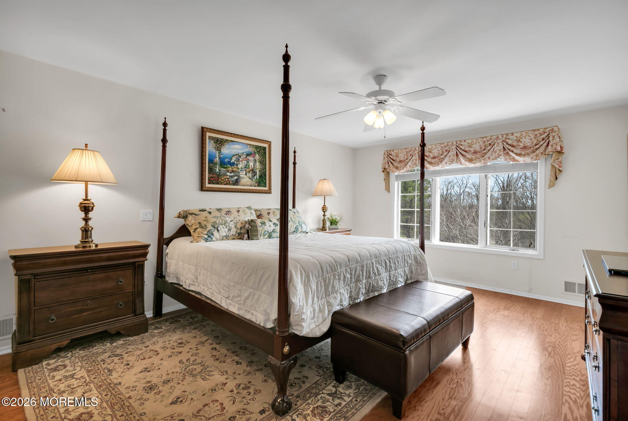 10 Paddock Lane Colts Neck, NJ 07722 - Photo 41 of 55 a spacious bedroom with a bed and wooden floor