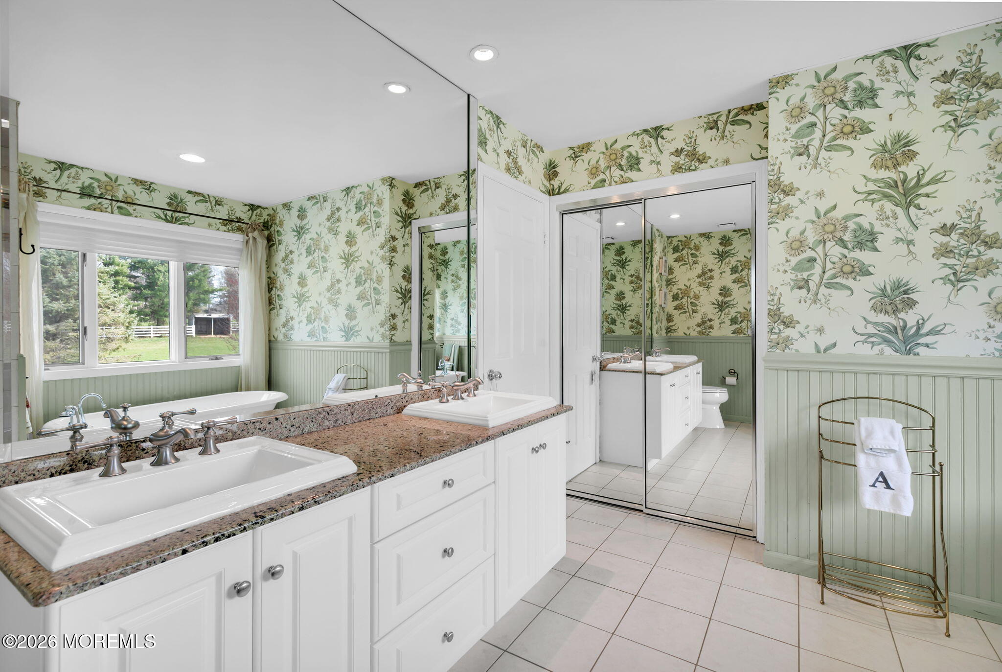 10 Paddock Lane Colts Neck, NJ 07722 - Photo 43 of 55 a spacious bathroom with a double vanity sink a mirror and a shower