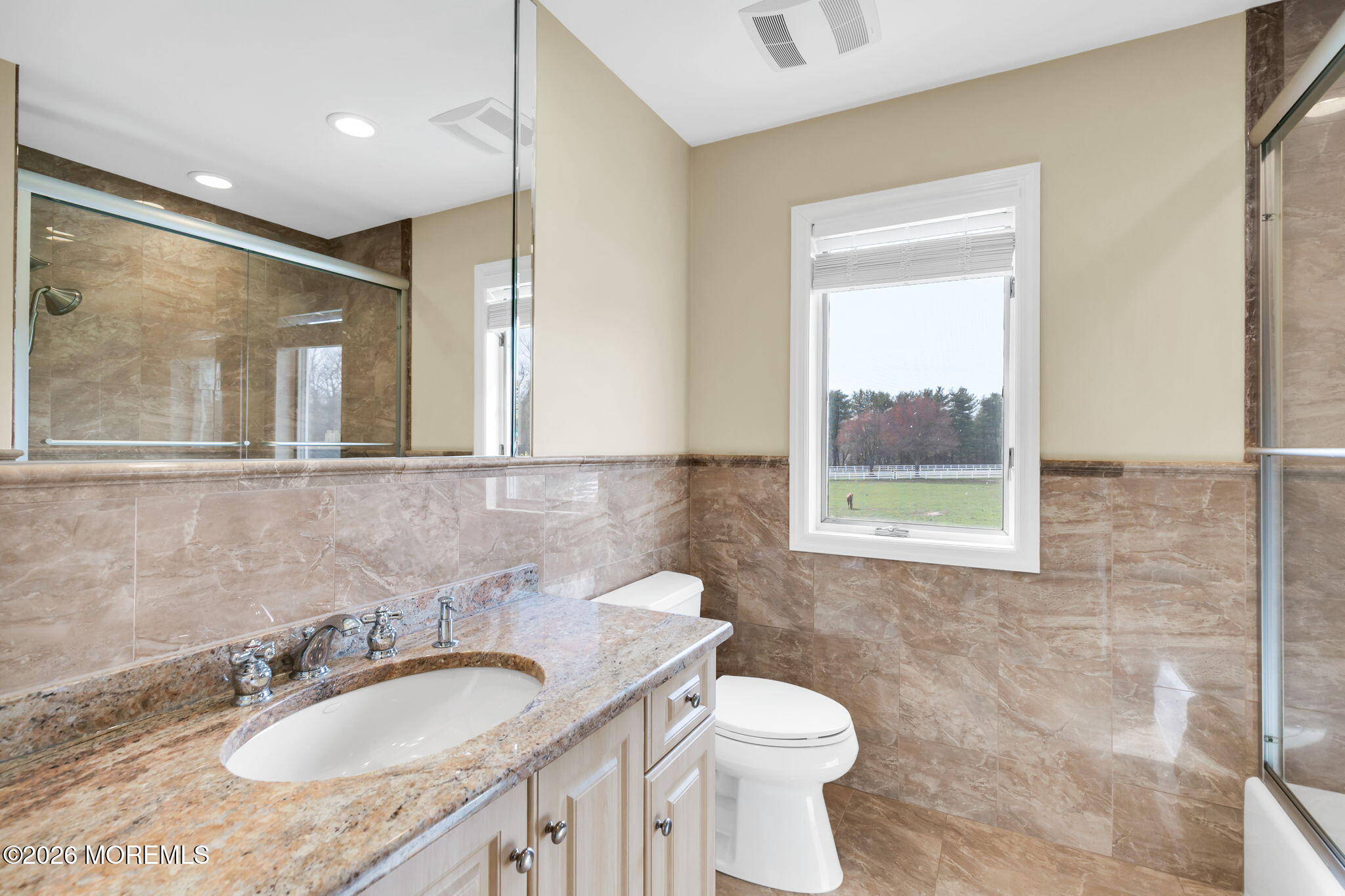 10 Paddock Lane Colts Neck, NJ 07722 - Photo 46 of 55 a bathroom with a granite countertop sink toilet and mirror