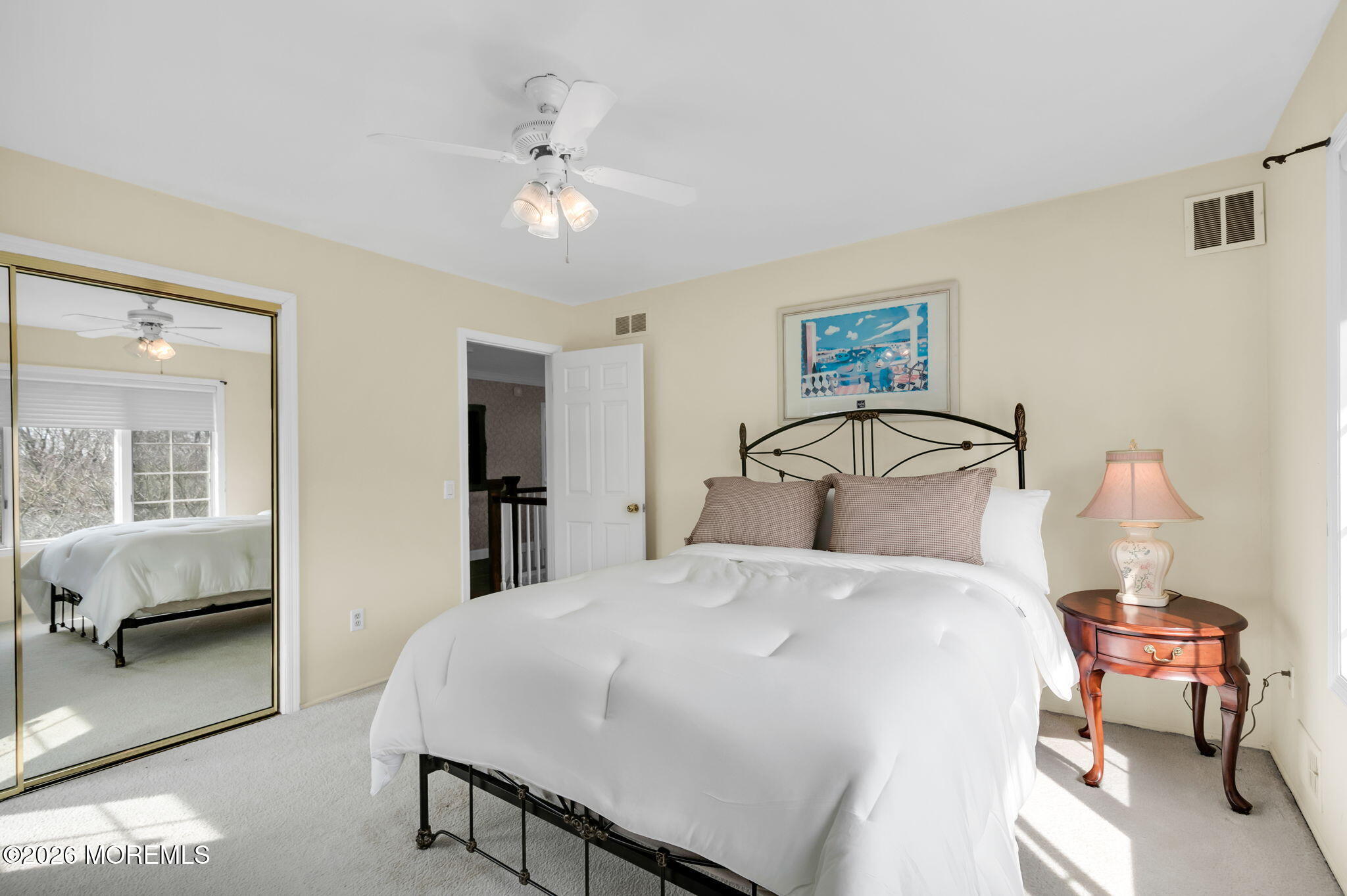 10 Paddock Lane Colts Neck, NJ 07722 - Photo 48 of 55 a bedroom with a bed and a chandelier