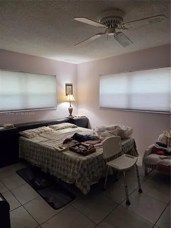 a bedroom with bed and window