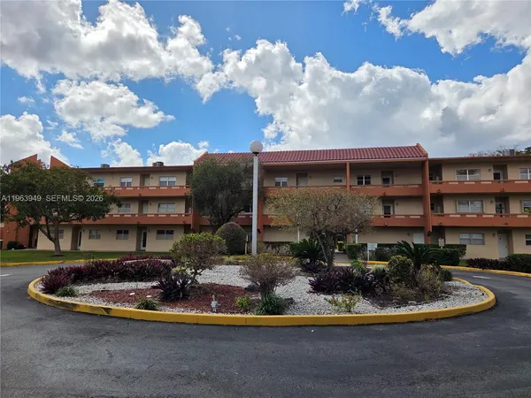 a view of a house with a backyard porch and sitting area