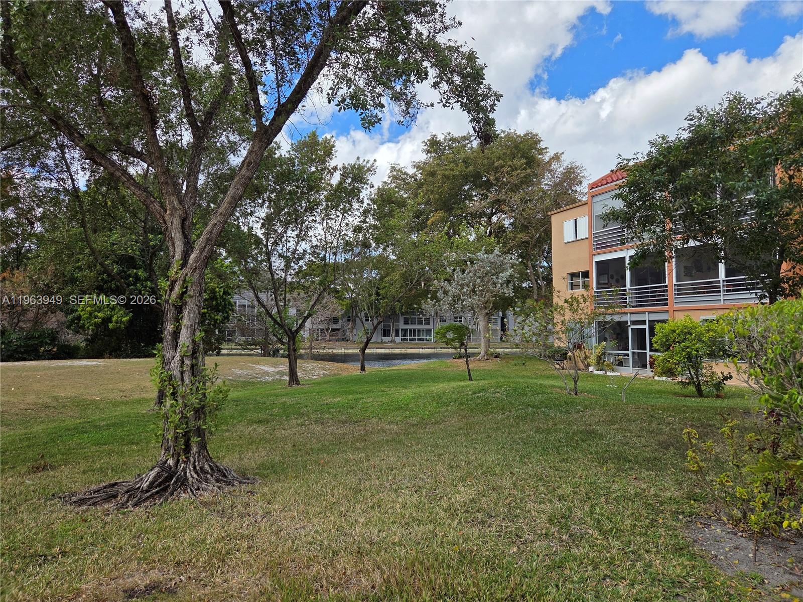 8834 West McNab Road, Unit 201 Tamarac, FL 33321 - Photo 22 of 27 a view of a backyard with green space