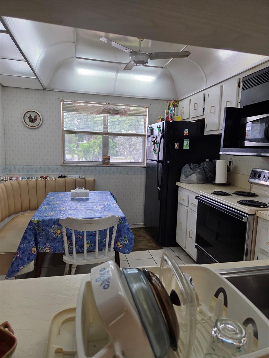 8834 West McNab Road, Unit 201 Tamarac, FL 33321 - Photo 6 of 27 a bed room with a bed and a television