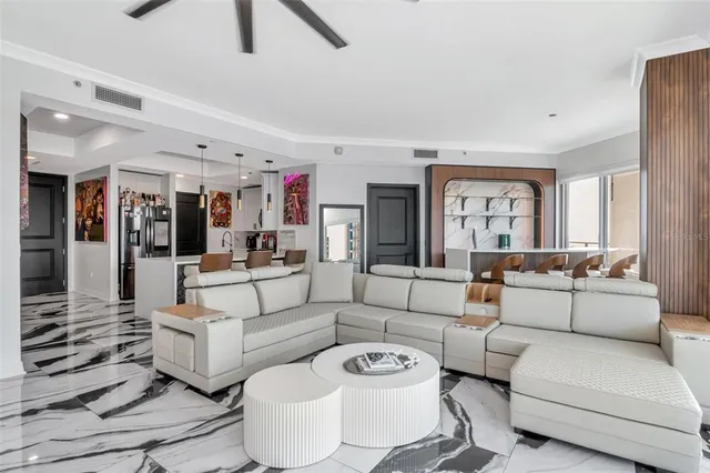 a kitchen with granite countertop a sink stainless steel appliances and white cabinets