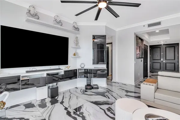 a kitchen with granite countertop a sink stainless steel appliances and white cabinets