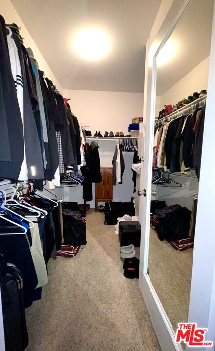 17983 Lost Canyon Road, Unit 116 Canyon Country, CA 91387 - Photo 11 of 11 a view of walk in closet with clothes and shoes