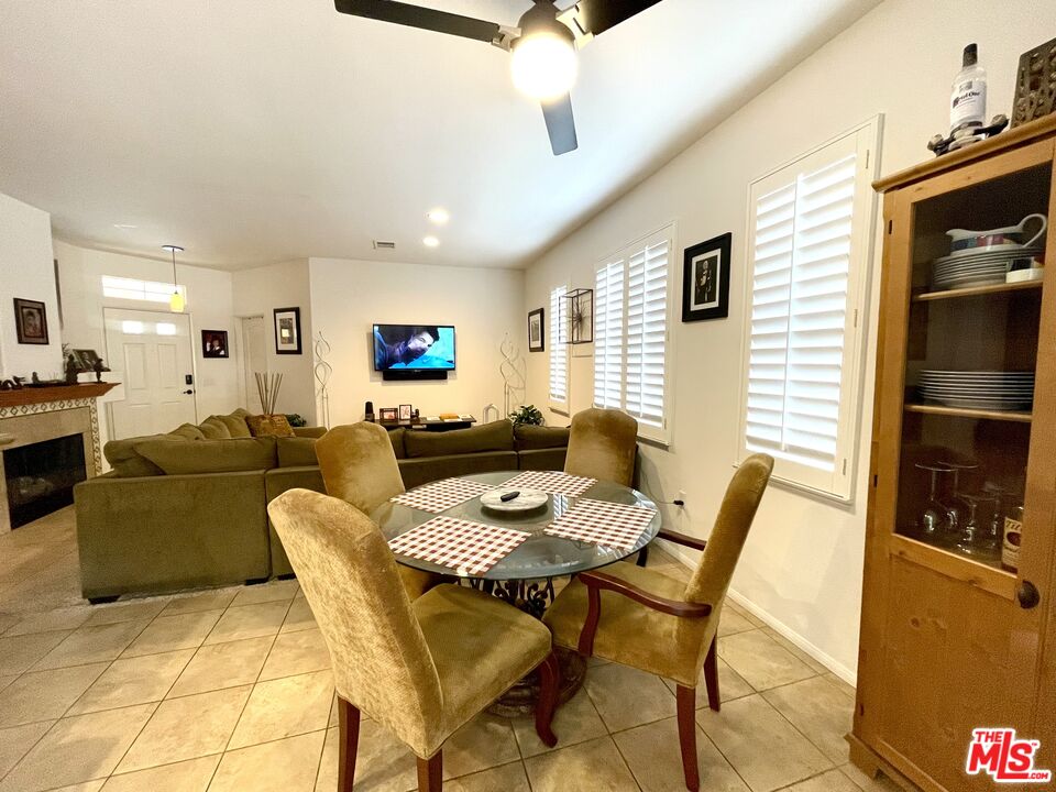 17983 Lost Canyon Road, Unit 116 Canyon Country, CA 91387 - Photo 5 of 11 a living room with furniture and a table
