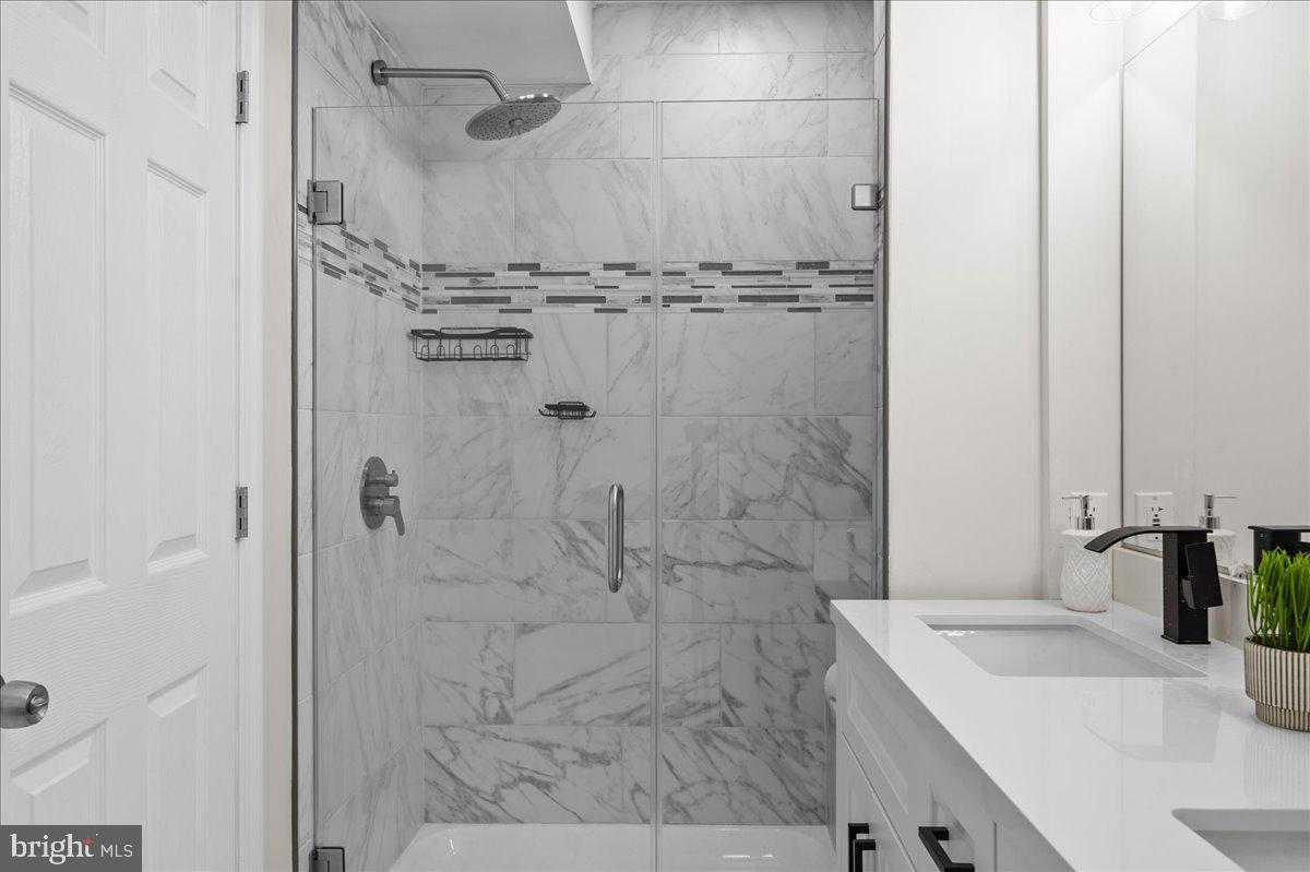 2011 Veale Road Wilmington, DE 19810 - Photo 21 of 43 Tiled shower in the ensuite primary bath