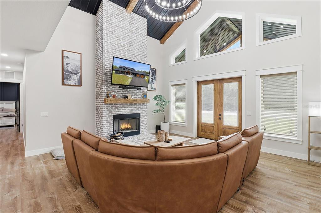 330 Highway 40 West Inglis, FL 34449 - Photo 16 of 87 a living room with furniture a fireplace and a table