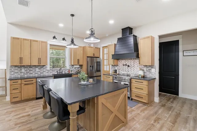 a bedroom with a bed and a ceiling fan