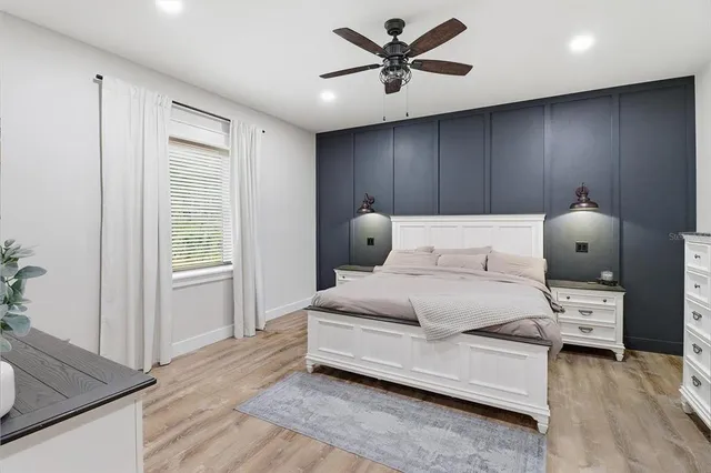 a workspace with wooden floor and a window