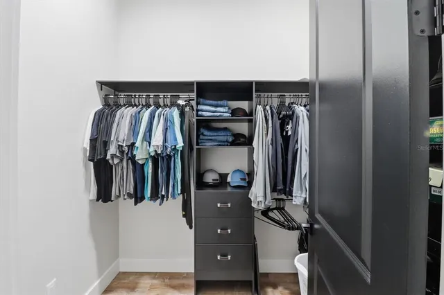 a view of walk in closet with stairs