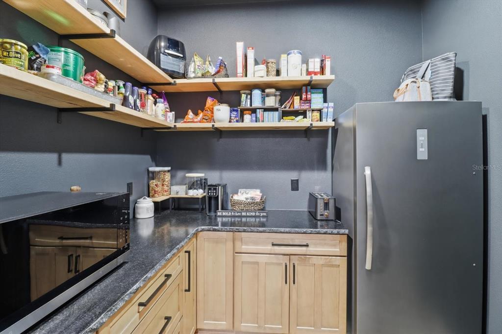 330 Highway 40 West Inglis, FL 34449 - Photo 61 of 87 a kitchen with stainless steel appliances granite countertop a refrigerator and a stove