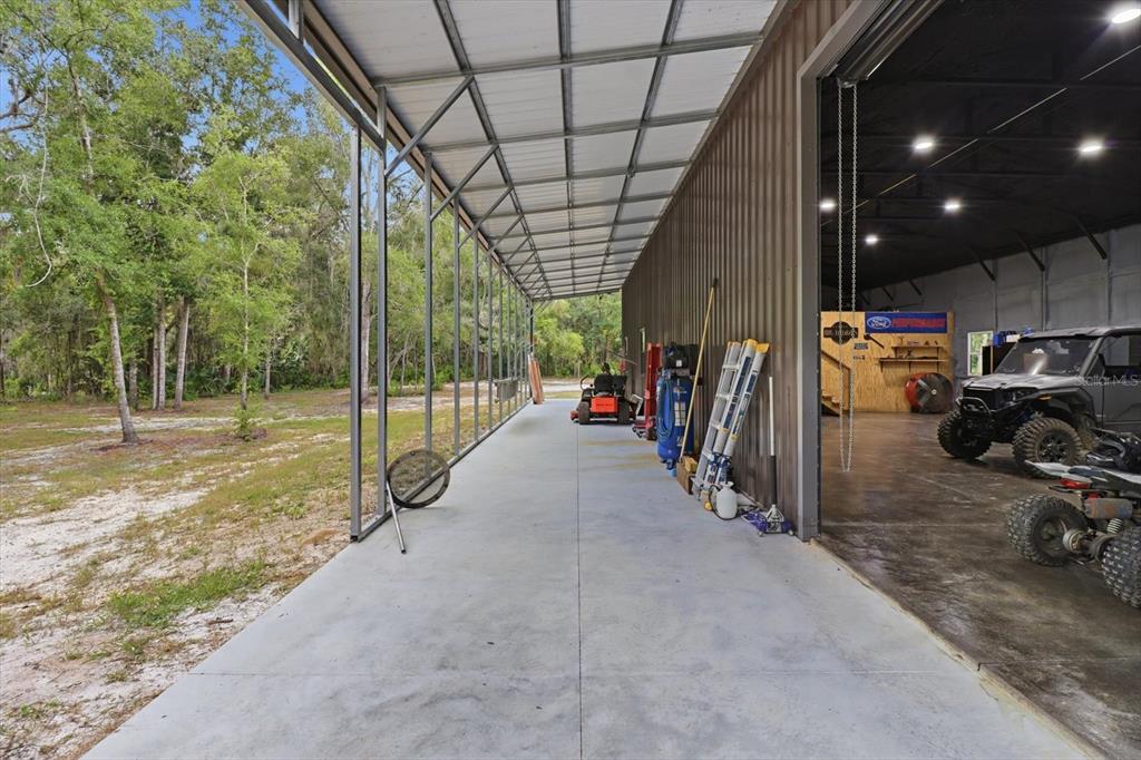 330 Highway 40 West Inglis, FL 34449 - Photo 64 of 87 a view of a garage with parked cars