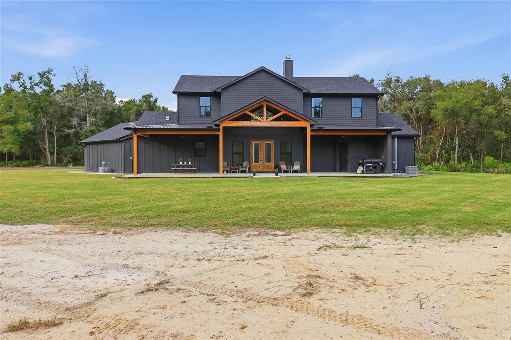 330 Highway 40 West Inglis, FL 34449 - Photo 73 of 87 a view of a house with a yard and potted plants