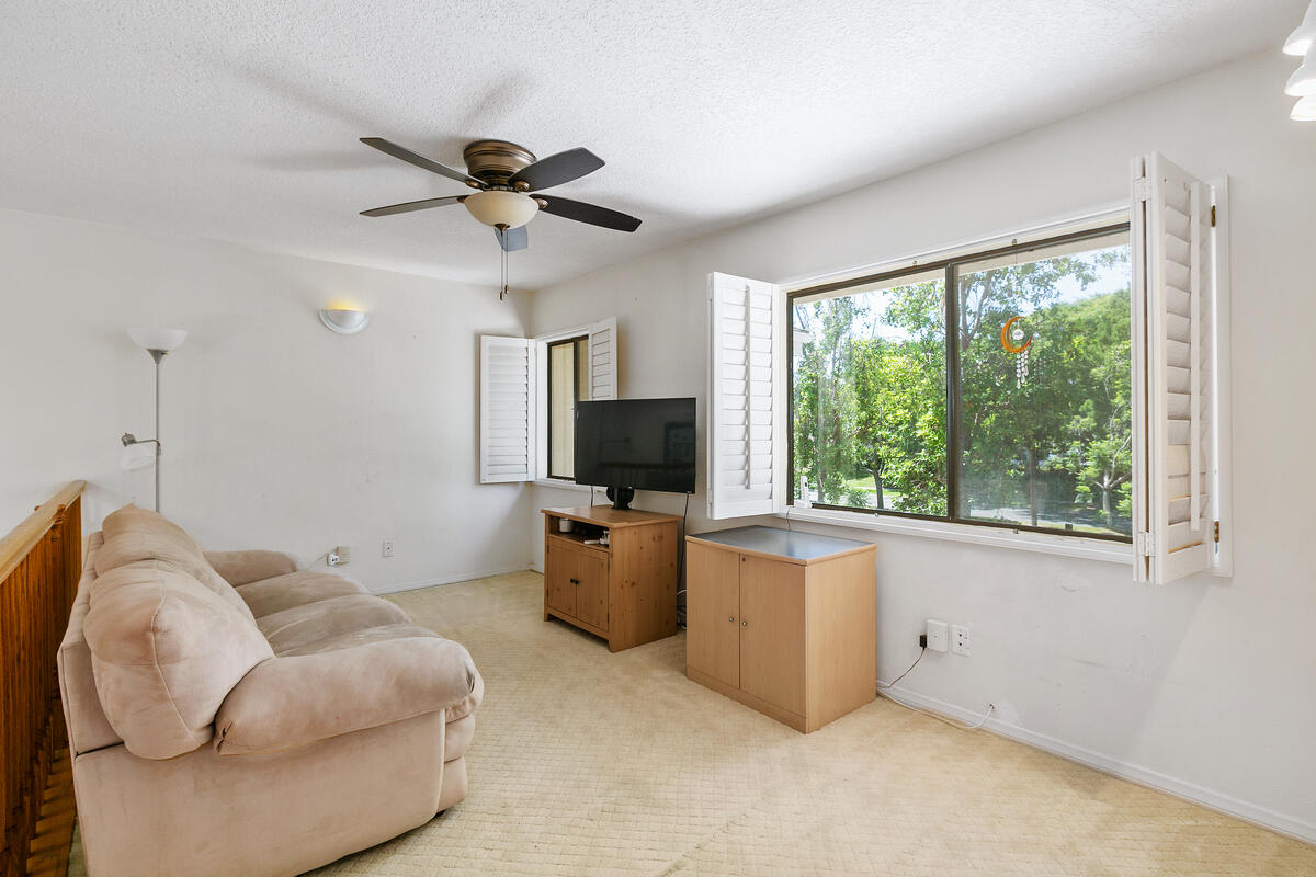 34 Rainbow Irvine, CA 92614 - Photo 19 of 44 a living room with furniture a flat screen tv and a large window