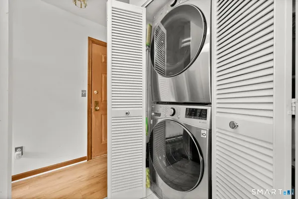 a close view of a utility room with dryer and washer