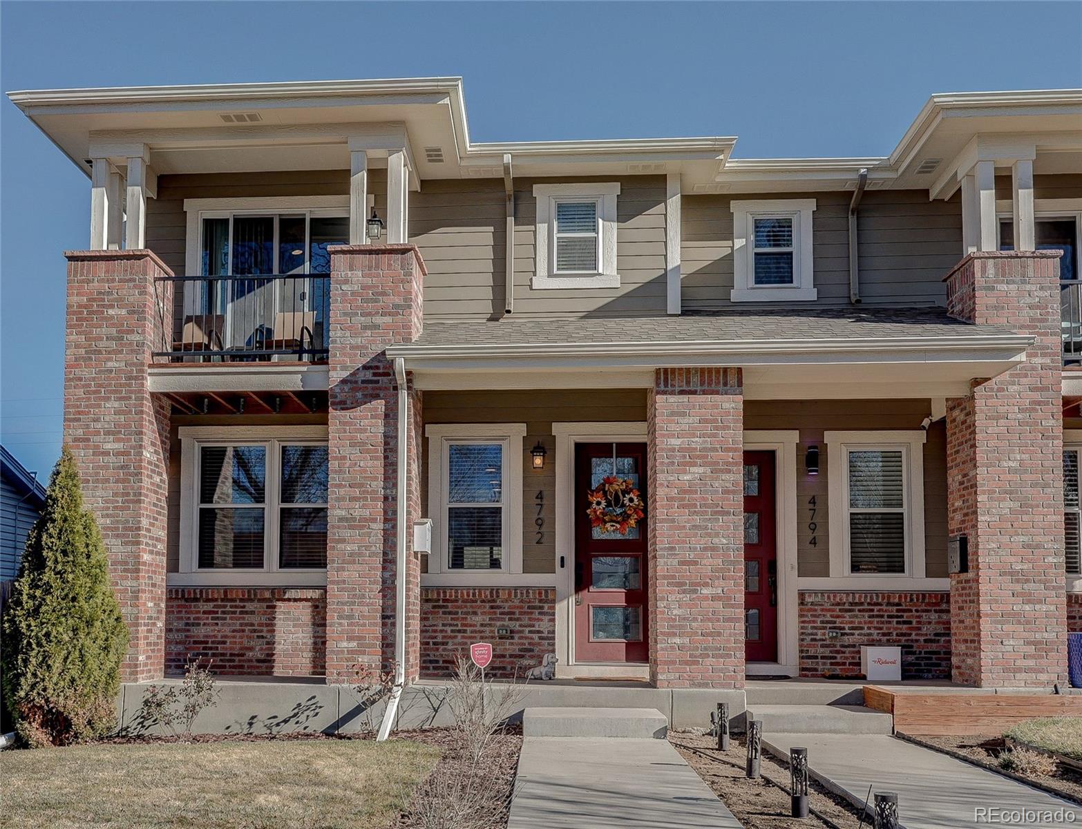 4792 South Acoma Street Englewood, CO 80110 - Photo 1 of 19 a front view of a house with glass windows