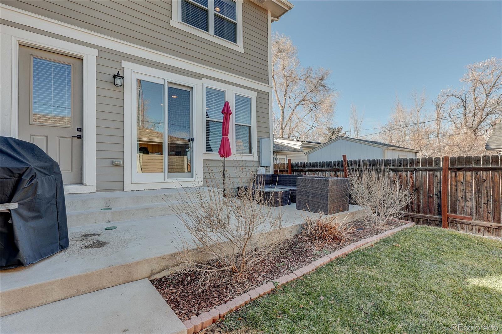4792 South Acoma Street Englewood, CO 80110 - Photo 18 of 19 a view of a backyard with sitting area