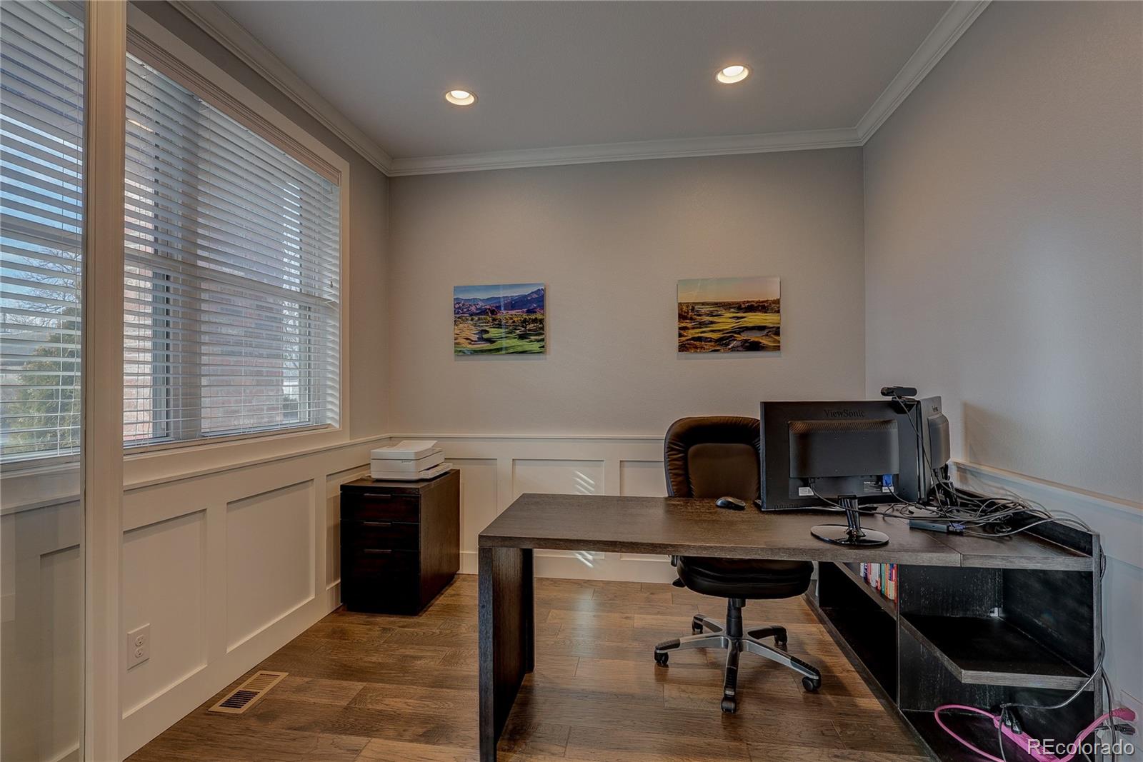 4792 South Acoma Street Englewood, CO 80110 - Photo 7 of 19 a view of a workspace with furniture and a window
