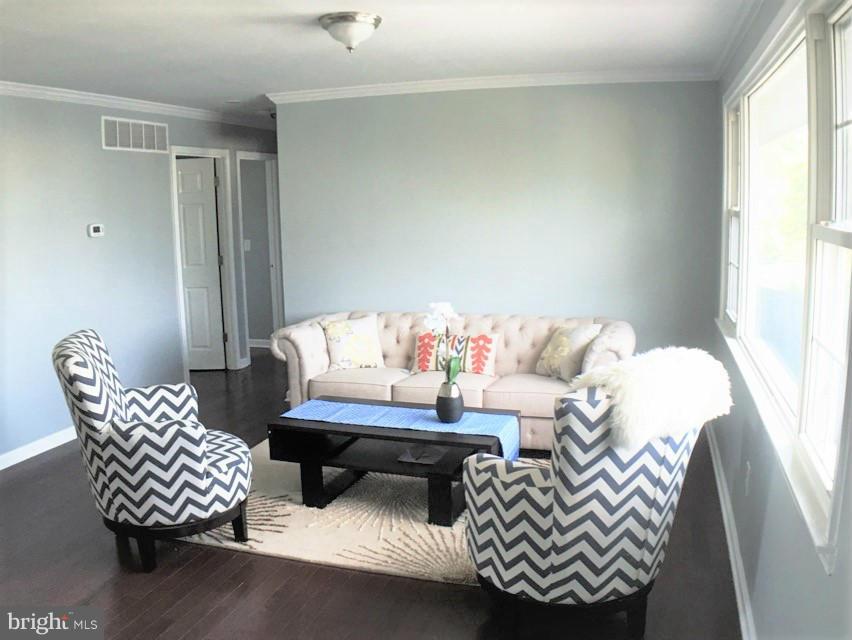 9729 Cross Road Perry Hall, MD 21128 - Photo 4 of 17 a living room with furniture and a window