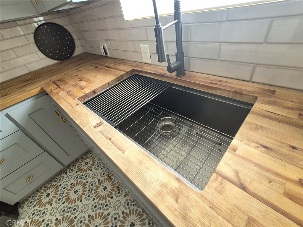 2624 Mill Creek Road Mentone, CA 92359 - Photo 6 of 24 farmhouse kitchen sink. Timeless butcherblock counters