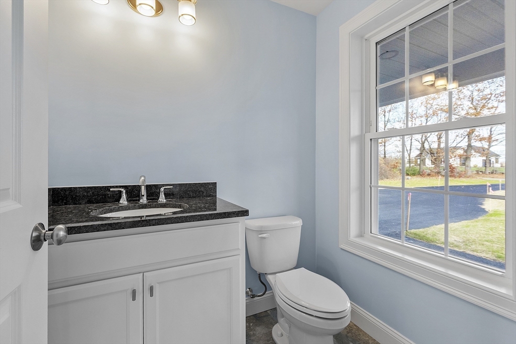 186 Justice Hill Road, Unit MOD FARM Sterling, MA 01564 - Photo 14 of 29 a white stove top oven sitting next to a toilet