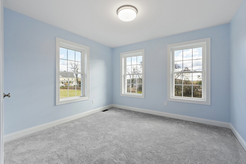 186 Justice Hill Road, Unit MOD FARM Sterling, MA 01564 - Photo 15 of 29 an empty room with windows