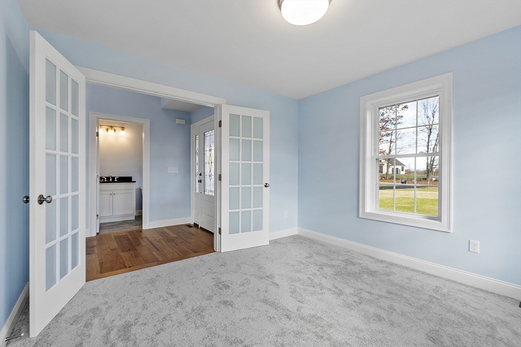 186 Justice Hill Road, Unit MOD FARM Sterling, MA 01564 - Photo 16 of 29 a bedroom with a bed and a window