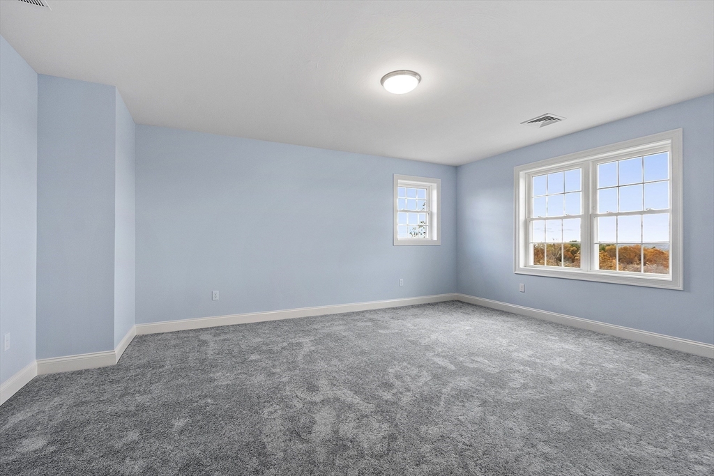 186 Justice Hill Road, Unit MOD FARM Sterling, MA 01564 - Photo 19 of 29 an empty room with windows