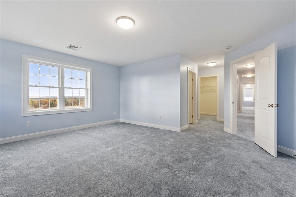 186 Justice Hill Road, Unit MOD FARM Sterling, MA 01564 - Photo 20 of 29 an empty room with windows and closet