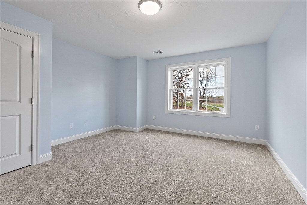 186 Justice Hill Road, Unit MOD FARM Sterling, MA 01564 - Photo 25 of 29 an empty room with windows