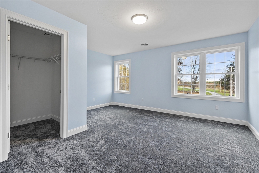 186 Justice Hill Road, Unit MOD FARM Sterling, MA 01564 - Photo 26 of 29 an empty room with windows