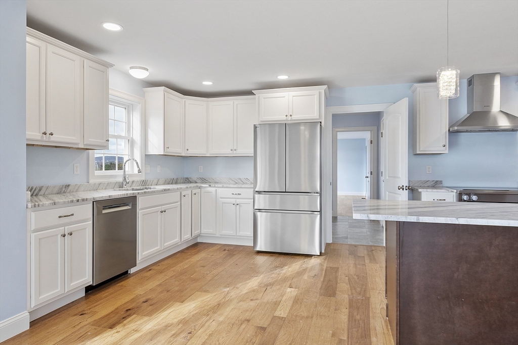 186 Justice Hill Road, Unit MOD FARM Sterling, MA 01564 - Photo 4 of 29 a kitchen with refrigerator and cabinets