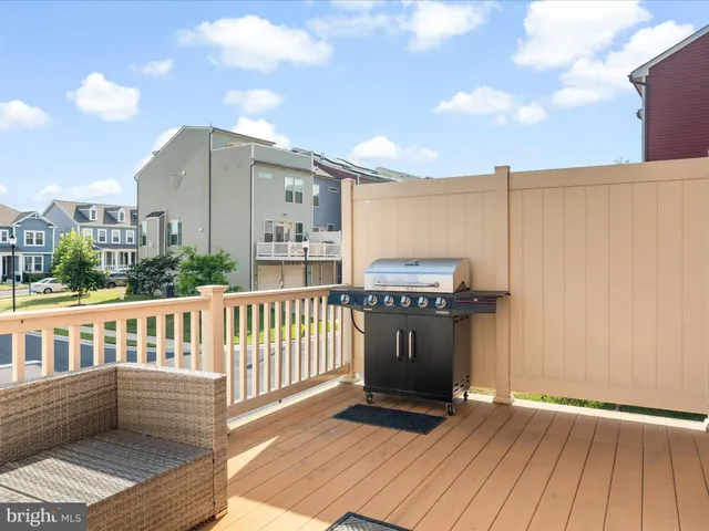 a view of a balcony with wooden floor