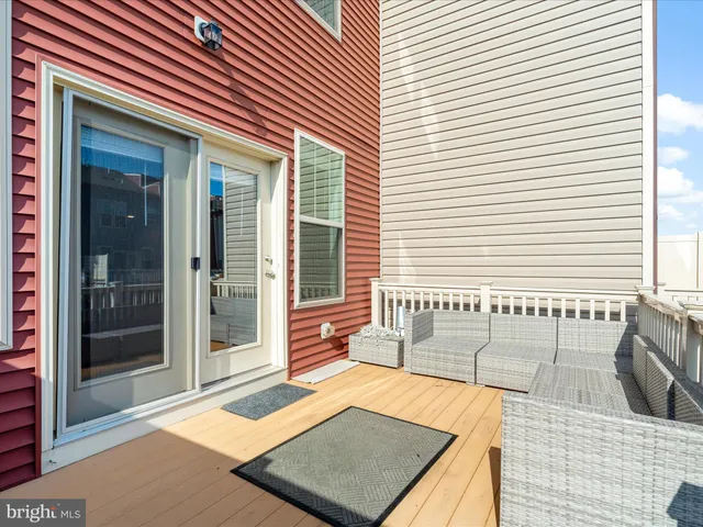 a view of an outdoor space kitchen and dining room