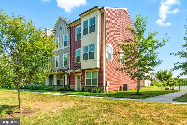 a front view of a building with a yard