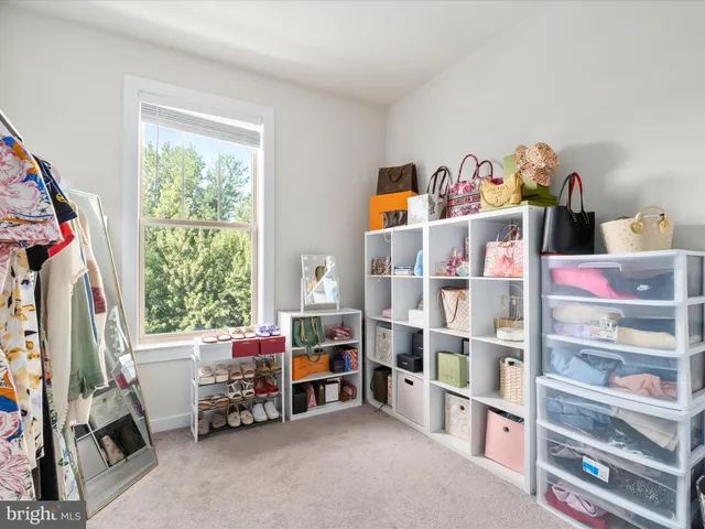 a bed room with a bed and a window