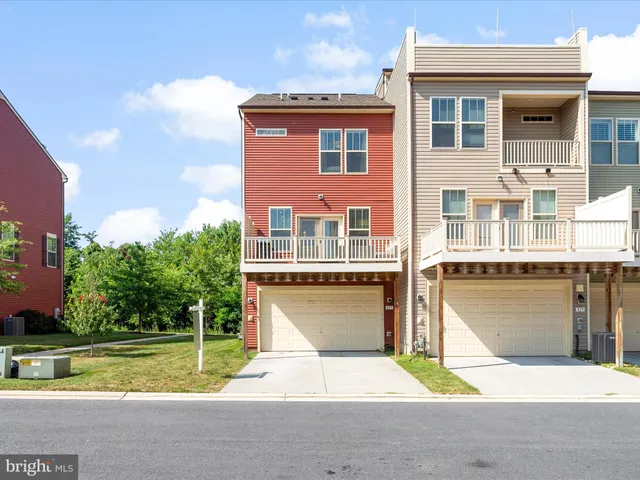 a view of a house with pool and a yard