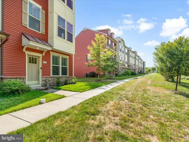 a view of a building with a yard